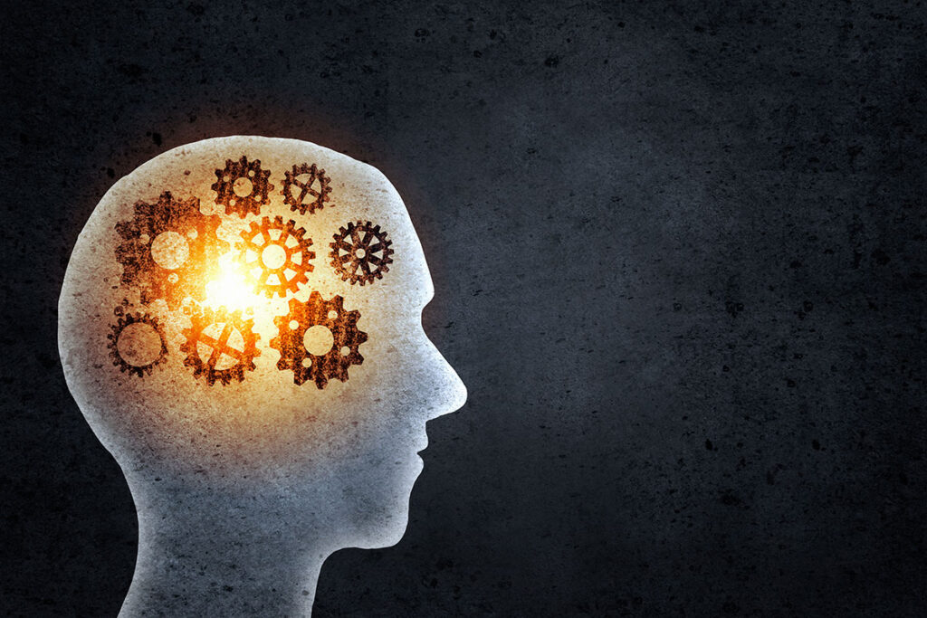 man silhouette with gears inside head