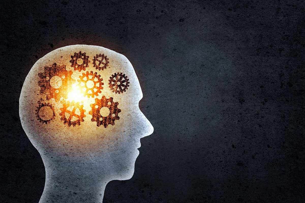 man silhouette with gears inside head